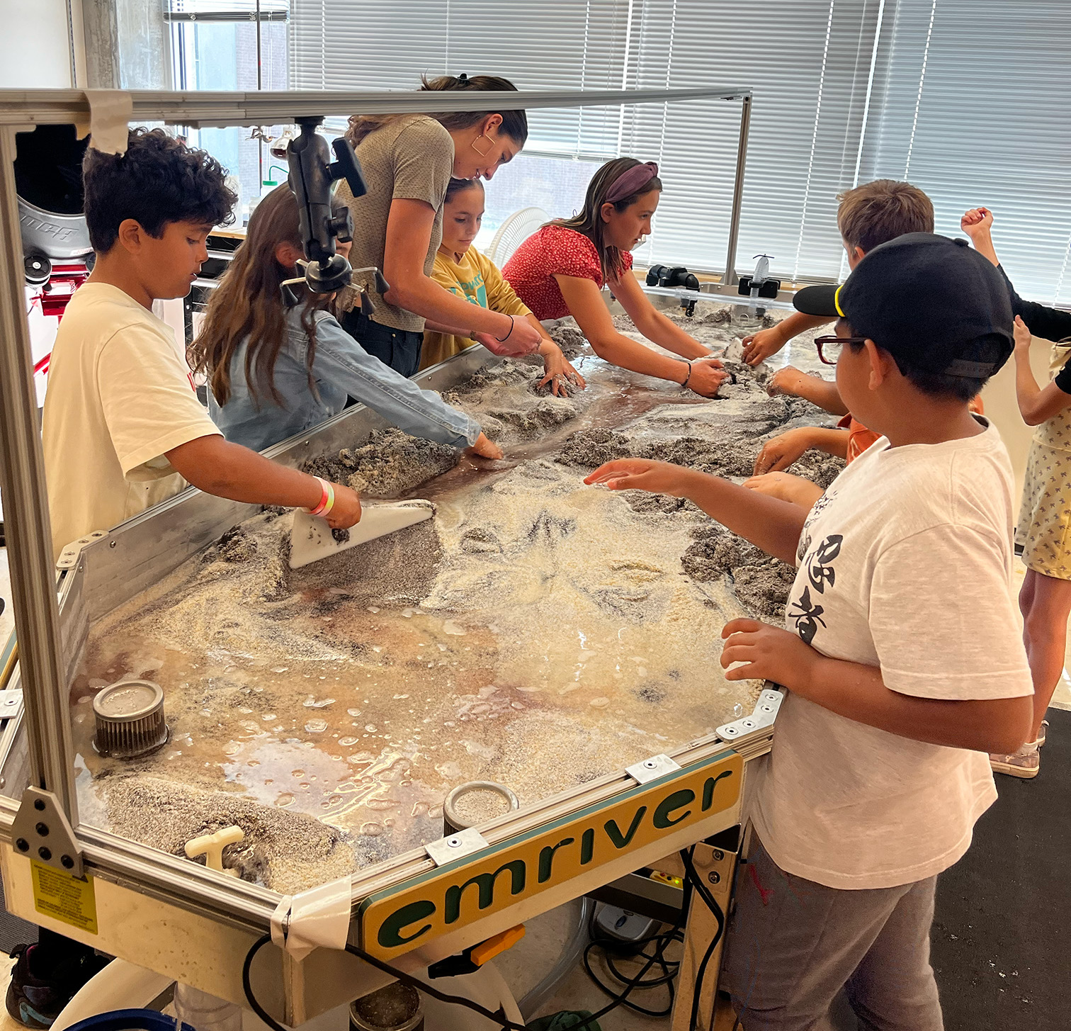 Kiri teaching 4th grades how to use the stream table.